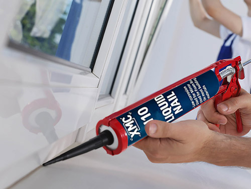 Low corrosion nail free adhesive